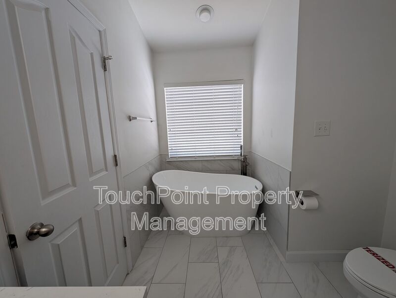Pristine End Unit Townhome located in the Prosperity Place community! property image
